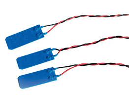 Blue switches with electric wiring attached to them